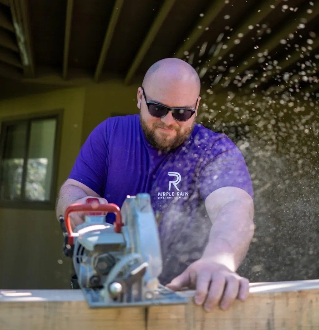 Nicholas cutting decking on a Central Oregon build